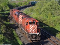 I don't shoot off the Courtice Road bridge often, but it's a nice spot when the light, and the power, is good. Here we have 6037, 9003, and 5959 leading 235's train past Darlington siding on their run to Toronto Yard, which was still a yard in 2009. I shot the last run of the last five MLW's here in June of 1998 in similar light on train 923. That was a photographers delight, made to order by a few folks at St Luc whos names many here could probably guess at. Three C424's and two RS-18's; a nice send off to the era of 251's on CP. Pity the SD40-2 did not get the same treatment, as they made a far greater contribution to the company than the MLW's, having held down the vast majority of road assignments for decades, not to mention being favoured far above the MLW's by road and maintenance crews alike. One assumes management was also pleased with GM's rugged six motor, given the 400 plus copies they bought new. But CP is a different company in 2016 than they were in 1998, and the SD40-2 era has passed largely in the same way they spent their service lives... unremarked. 1901hrs.