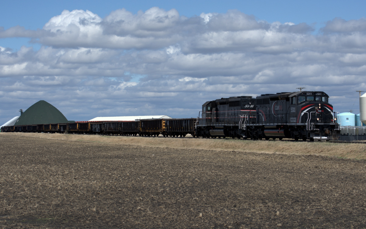 Headed towards Carman, MB with a load of gondolas.