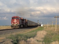 Heading west into Boharm, SK with one of the many elevators in Moose Jaw visible in the background. The sun starts to shine after a prairie thunderstorm.