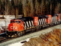 Probably my favourite shot from my time on CN in Alberta. A "W" leading 2 regular SD40's, and then a 40 foot box at the head end of a unit grain train. I never did get the sulphur train I'd hoped for from this vantage point. The regular 40's are long gone; not sure about 5357