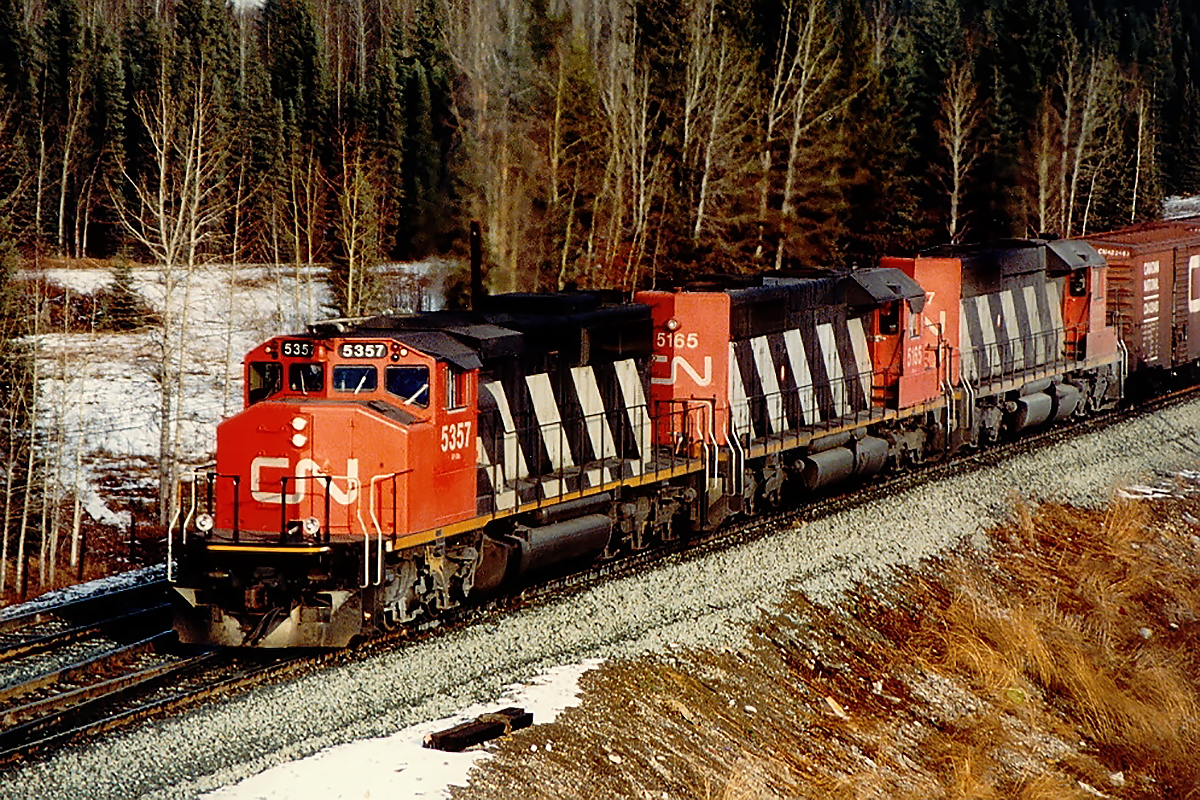 Probably my favourite shot from my time on CN in Alberta. A "W" leading 2 regular SD40's, and then a 40 foot box at the head end of a unit grain train. I never did get the sulphur train I'd hoped for from this vantage point. The regular 40's are long gone; not sure about 5357