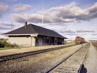 CN 5085, 5148 and 5257 roll to a stop at Atikokan station, running westbound. Upon leaving here they will be entering the Fort Frances Sub.  I'm unsure what the unit train contents consisted of, only that it is empties on return, (potash?) but I am sure of who the photographer is that could not get his shadow out of the photo in the late afternoon sun. :o)  The station was demolished around 2012. 
