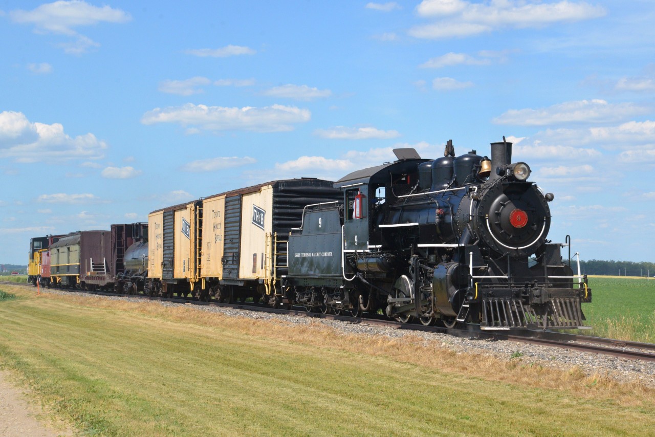 The fine folks at Waterloo Central Railway hosted a steam photo freight on June 30, 2016 and powered by Essex Terminal Railway No. 9.  ETR #9 is a 1400 h.p. steam powered 0-6-0 hand fired, coal burning locomotive built in 1923 by the Montreal Locomotive Works. Railfans rode and photographed the special steam freight consist at the Station & Restoration Shop in St. Jacobs before crossing the Conestoga River and heading deep into Mennonite farming country to the Waterloo Spur terminus in Elmira and return. Photo run-by location is in the midst of lush crops mid way between St. Jacobs and Elmira.