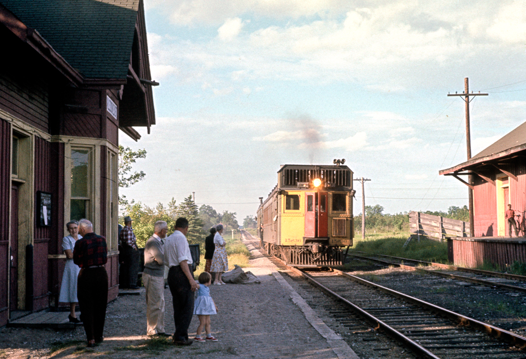 CN oil electric 15836 with trailer car C-1 is seen arriving at Caledon East on June 18, 1960. This is the same Barrie-Gerogetown-Hamilton train in Clayton Morgan's photo I posted earlier ,taken at Inglewood when it consisted of an SW1200, baggage car and coach. Special thanks to Ian for allowing me to share this historic gem.
This service was discontinued a few months later and 15836 was retired in 1960 as well.