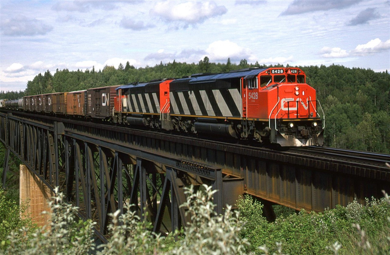 An eastbound manifest train crosses high above the McLeod River just east of Edson.
More high bridges.....