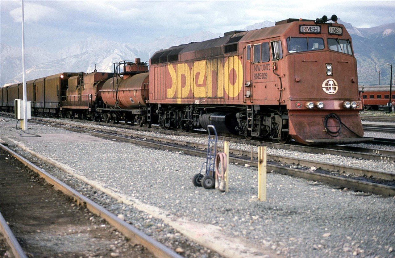 My wife and I took the Super Continental to Jasper one day. The trip was made much longer than scheduled because CN's CTC was down. We arrived very late into Jasper and the sun was already behind the mountains. But I saw this Speno rail grinding train parked near the station, and decided to take a couple shots. It would be a few more years before I would get a chance to see one in action. 
We rode the Super home the next day - not much to do in Jasper without wheels.