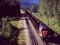An eastbound coal empty rumbles through Avola. There appears to be some MOW equipment in the siding at the bend.