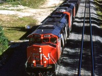 I have been up and down this stretch of road (Kamloops to Jasper) several times, but considering that it parallels the CN the entire way, I have very few photos to show for it. For those that have traveled this route, you know that it is heavily forested, very lightly developed, and more likely than not, you are just trying to make miles - it is a long journey. Don't get me wrong, there are a few places where I would love to linger and catch a few trains. The area from Kamloops to Barriere seems quite intriguing, as is the 60 km west of Jasper. But in between, most is hidden or inaccessible.
Here, we caught a westbound coal train, just south of Blue River as it is about to pass under the highway. Chasing it would be very time consuming as we were headed east. The road crosses the North Thompson River almost immediately, while the tracks remain on the west bank all the way back to Avola (about 30 km).