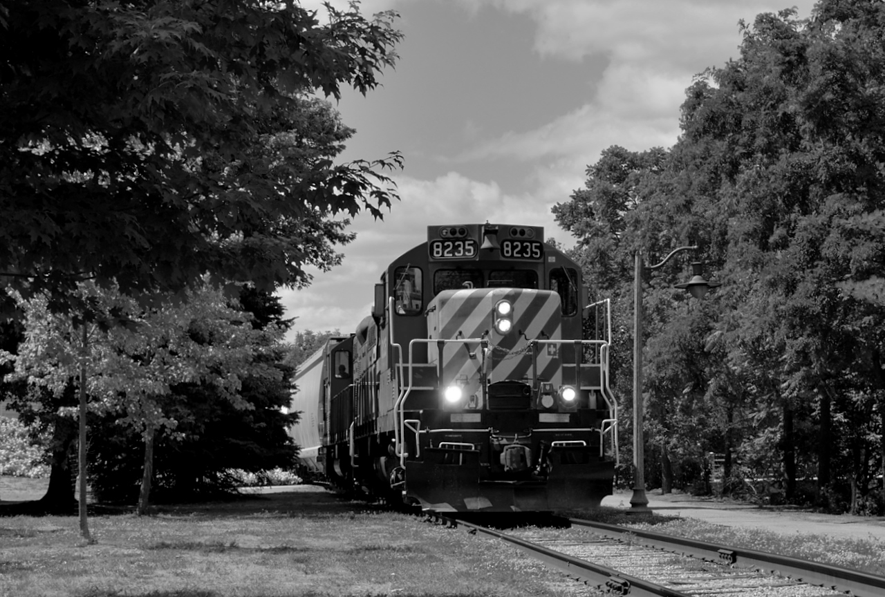 The ex CP GP9u's roll slowly through Downtown Guelph with a short train in tow.  They still have some work to do this afternoon at PDI Elizabeth and PDI Bulk Liquids.A note to the OSR fans; the caboose is back! :)