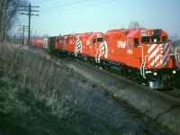 Fresh out of GMD London, CP's first four GP38-2s are on the Cobourg turn westbound at Bowmanville. 3023 is leading 3024, 3022 and 3021. Over one hundred more GP38-2s will follow in the next three years. 3000-3020 were slightly different model GP38-ACs.