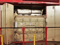 Here is the view of one half of an EMD 710G3B turbocharged 8 cylinder locomotive engine that pumps out 2000 HP. The starter motors are behind the cover below number 4 cylinder. Beside the number four is the white cylindrical turbo oil filter.