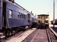 Comboose 303 sits beside bay window caboose 13003. Photo taken by my brother during a shop tour.