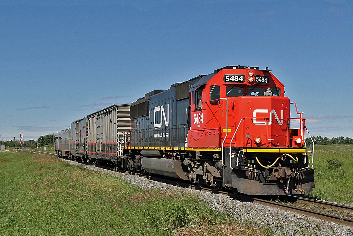 CN's engineers track inspection train is seen heading east from Lindbrook.  Headed by SD60, CN 5484, complete with "dash cam", followed by ATGMS test car CNA 515867, DGRMS test car CN 414852 and on the rear Dayliner 1057.