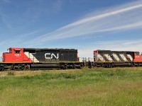 A pair of SD40-2(W)'s head down the Fort Saskatchewan industrial lead with a cut of hoppers and tank cars.