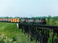 Okay, so I suppose with most of you this is considered Brantford. But it is outside the city proper, so I label it Lynden West. Sounds more "country-ish".  Anyway, back in 1984 at the first of June it was a beautiful morning watching trains over Fairchild Creek. This location I enjoy early; at this time of the year, from sun-up until maybe noon and then the sun angle becomes a negative factor. In this old shot we see grimy old (the way we remember them) MLW C-630M 2024 and 2039 and M-636 2329 trailing, running eastbound.  Fan favourites back then, and even in 1984 not all that common any more. They were off the roster by 1996.