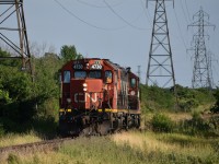 CN 584 heads up the Talbot sub towards London with 2 locomotives, CN 4730 a GP38-2, and CN 4116 a GP9Rm.