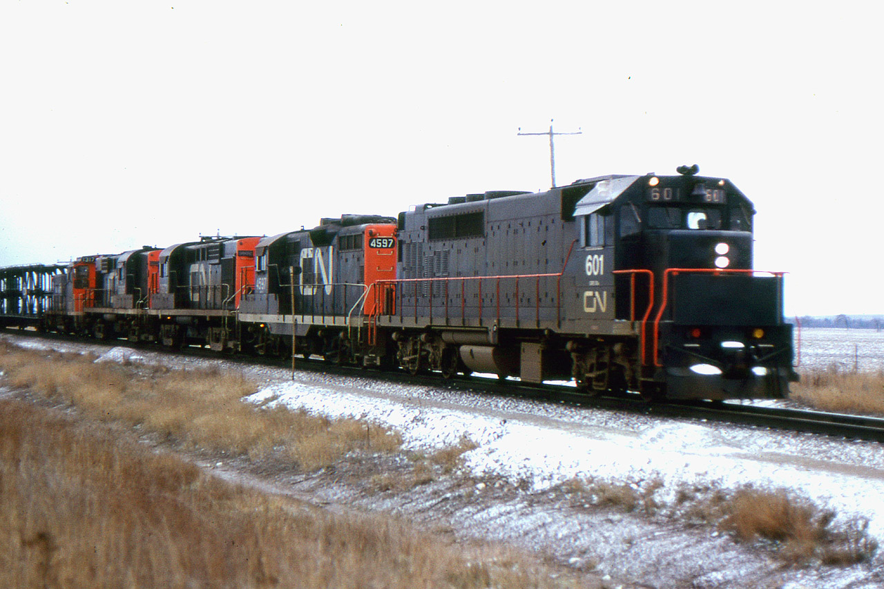 The first locomotives for GO Transit were the GP40TC model built in 1966. GO was not ready for start up so they were used in CN freight service for a few months. Here we see 601 leading an eastbound near Milton in December 1966.