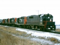 The first locomotives for GO Transit were the GP40TC model built in 1966. GO was not ready for start up so they were used in CN freight service for a few months. Here we see 601 leading an eastbound near Milton in December 1966.