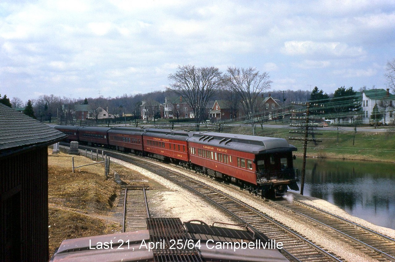 Another view of the last CP Montreal-Toronto-Windsor-Detroit full-service train #21 passing through Campbellville on the CP Galt Sub, this time showing its tail-end observation car bringing up the rear as the train gets ready to make its station stop at Guelph Junction.

CP #21's head end passing by seconds before: http://www.railpictures.ca/?attachment_id=25072
Leading F-units at Guelph Junction station: http://www.railpictures.ca/?attachment_id=24875