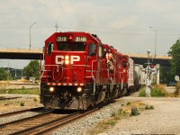 I was lucky enough to see the Local in Woodstock at the end of June, while on a railfanning trip with Mr. AW Mooney himself. However, I did not the greatest of shots as it whisked through Woodstock. A couple of weeks later, and luck be shining on me as I just captured it as it departs Galt. Here a trio of units led by 3118 accelerates out of the yard, westbound for Woodstock.