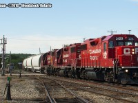 CP 3129 leads the local eastbound across Ingersoll Avenue in Woodstock.