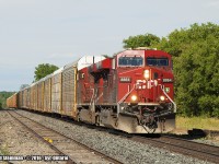 A westbound autorack train, with two CP units in charge (8864 & unidentified) roll through Ayr.