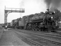 <i><b>A personal favourite:</b></i> Steam was still common on the CPR's Galt Sub in August 1959. I was at Guelph Junction late on a Saturday afternoon to observe a westbound freight stopped for water by the station. Road engine was P3 Mike 5370, and "push engine" to assist was G1 2228 up front.