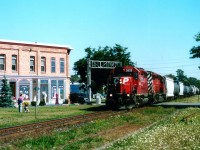 Westbound CP 5806, 6019 crosses William St S in downtown Chatham. The public land around here at the time made it a nice place to park and listen for freight moves.  And I liked the building.  If you did not notice right away that all those storefronts are fake, as are two upstairs windows, then the artists have accomplished what they set out to do.