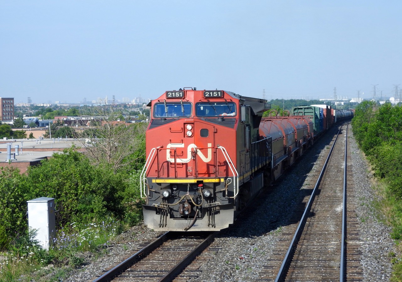 Pt.Robinson to Mac Yard train L524 crosses the Humber River with CN 2151 ex BNSF/ATSF 832 (gullwing) on the point.