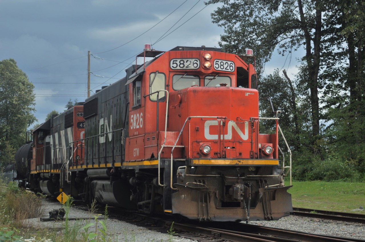 With a single tank car, CN's Seymour Branchline switch job waits as its crew contemplates their next move. The Seymour Industrial Branch serves three chemical plants on Vancouver's North Shore, and generates a fair amount of traffic going east via the Yale Sub, and south via BNSF's New Westminster Sub, and keeps this crew busy sorting incoming and outgoing cars for hours every evening.