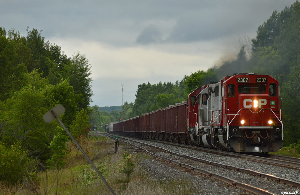 CP 2307/CEFX 3109/CP 2263 are giving GPS-08 everything they've got maxed out with 40 stone loads for unloading on the Belleville sub and 37 cars of Sudbury traffic for connection with 246 at Spence. It was pretty nice to hear the old SD40M-2 (built as SP 7344) at full throttle with some serious tonnage echo that familiar EMD battlecry!