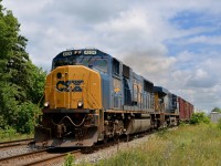 <b>SD70MAC on the Kingston Sub.</b> SD70MAC CSXT 4534 leads a 70-car CN 327 westwards on the south track of the Kingston Sub. Up ahead in Coteau the train will leave the Kingston sub for the Valleyfield sub, and eventually the U.S. Trailing is CSXT 5395.