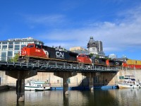 <b>A pair of ex-Super Fleet units up front.</b> CN 2189 & CN 2151 (originally ATSF 854 & ATSF 832, Super Fleet Dash8-40CW's) along with CN 2636 lead CN 149 over the Lachine Canal. This shorter than usual intermodal train is 9,868 feet/438 axles long.