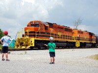 Now kids, today's lesson is all about the SD40-2...  The boys take a break from throwing rocks at a dead tree to watch RLHH 595 switch out tank cars at Garnet.  The crew came on duty much later than usual (after noon) so we had lots of time to kill before seeing the "orange train" in action.
