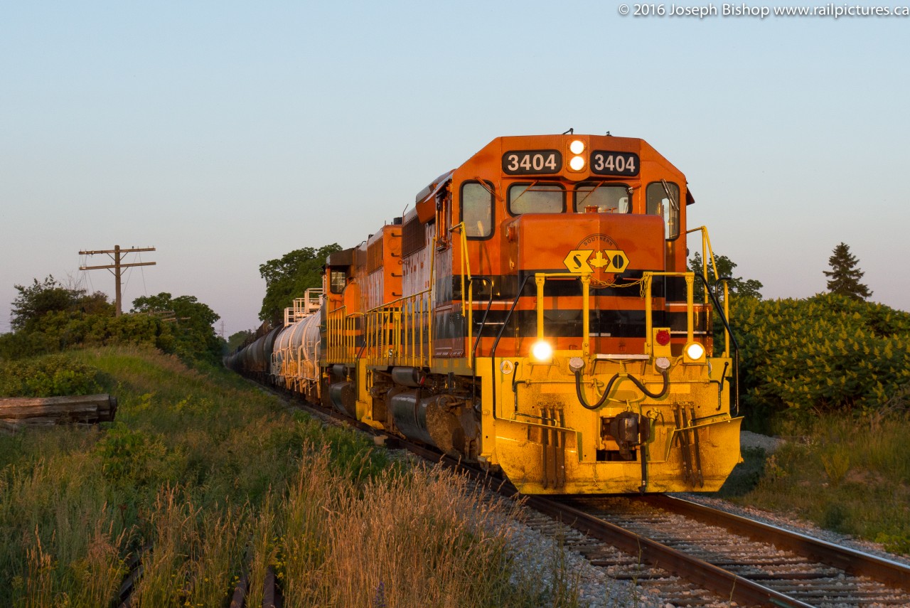 The last rays of the day shine upon RLHH 3404 as SOR train 597 approaches the crossing at Brant County Road 22, the diminishing light ended my chase of 597 here.