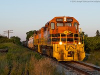 The last rays of the day shine upon RLHH 3404 as SOR train 597 approaches the crossing at Brant County Road 22, the diminishing light ended my chase of 597 here.