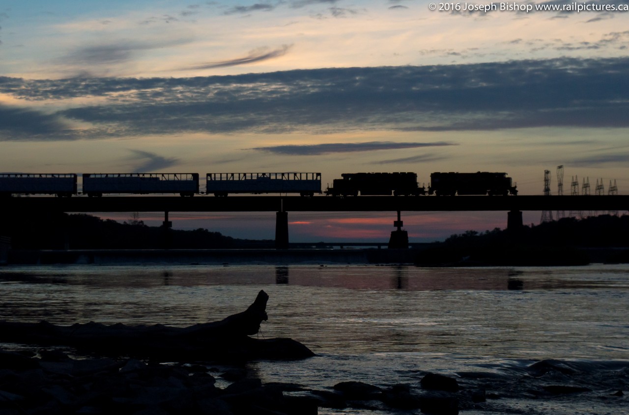 As the last light of the day quickly disappeared, RLHH 3049 and RLHH 3404 lead a long 597 across the Grand River in Caledonia