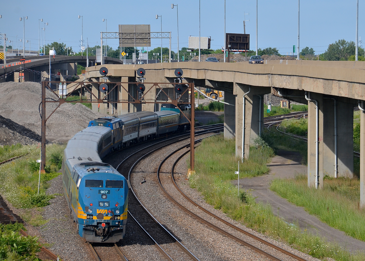 Shoving on the rear of a well-powered passenger train. VIA 633 for Ottawa is approaching Turcot West with VIA 907 bringing up the rear, along with VIA 6411 leading, and a second P42DC in the middle of the train.