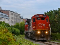 The day after CN 2033 led CN 149, what should lead CN 149 but CN 2032? An odd enough coincidence in my opinion, on top of that both trains had the exact same amount of axles (566 total). Here CN 149 slowly exits the Port of Montreal this morning at the allowed speed of 10 mph on an overcast morning (which was fine with me as this shot would not be very doable if the sun was out at this time).