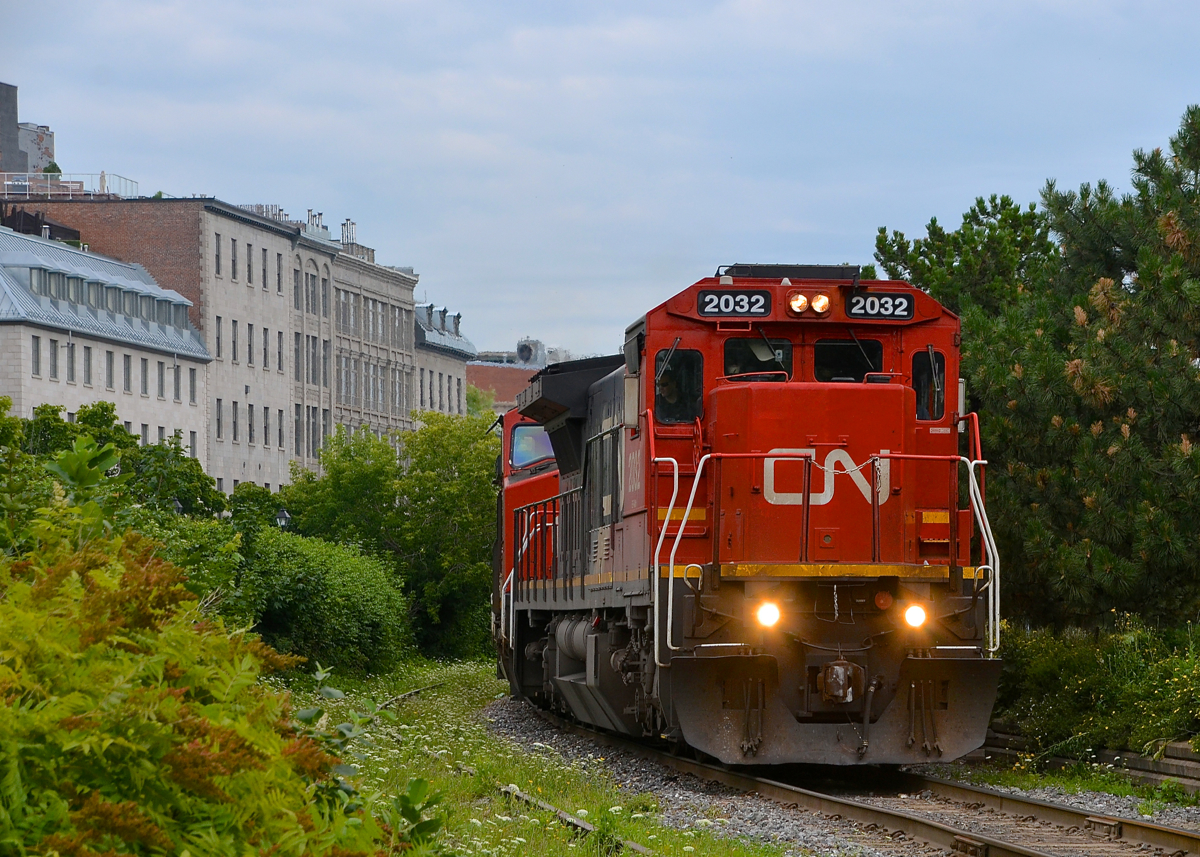 The day after CN 2033 led CN 149, what should lead CN 149 but CN 2032? An odd enough coincidence in my opinion, on top of that both trains had the exact same amount of axles (566 total). Here CN 149 slowly exits the Port of Montreal this morning at the allowed speed of 10 mph on an overcast morning (which was fine with me as this shot would not be very doable if the sun was out at this time).