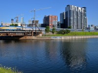 <b>100% stainless steel.</b> For quite some time VIA 63 was running with a single LRC among 5-6 stainless steel cars. Since the June 1st VIA Rail schedule changes it has been running with a 100% stainless steel consist. Here it passes Montreal's skyline five minutes after leaving Central Station with seven stainless steel cars in tow. Click <a href=http://www.railpictures.ca/?attachment_id=22762>here</a> for an example of how VIA 63 looked with a single LRC car in the consist.