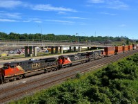 CN 2671, CN 2028 & CN 2622 slowly head west on the freight track of CN's Montreal sub with CN 149 as they are about to drop off CN 2028 at Turcot West before continuing west.