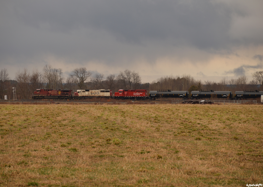CP 420 pulls over the diamond and past the small interchange yard in Utopia with CP 8531/SOO 6027/CP 2262 and 14 brand new SHPX tanks for the BCRY going into storage on the Penetang spur, where they are still sitting now. After a quick meet with 247 at Essa and the setoff here, they'll scoot into the old Ypres siding to clear and leave their tail end setoff for Spence to pickup later, also letting 330 by currently stopped behind them at Essa after meeting 247 at Craighurst while 420 works here at Utopia! After hours of quiet, it's amazing how quickly things can start happening on the MacTier sub sometimes!