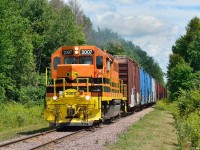 Pulling hard with twenty-six cars QG 2007 approaches Marelan, Quebec on a beautiful summer day.