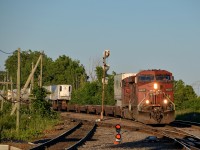 <b>CP 133 around the corner.</b> CP 8537 & CP 8714 lead CP 133 through Lachine on a sunny evening.