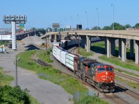 CN X324 has CN 2596 & CN 2286 for power and 48 cars in tow destined for St.. Albans, Vermont and interchange with the NECR as it heads east on CN's Montreal sub.