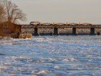 <b>Something to cool you down.</b> AMT 1322 pushes AMT 75 for Candiac over the mostly frozen St-Lawrence river this past January.