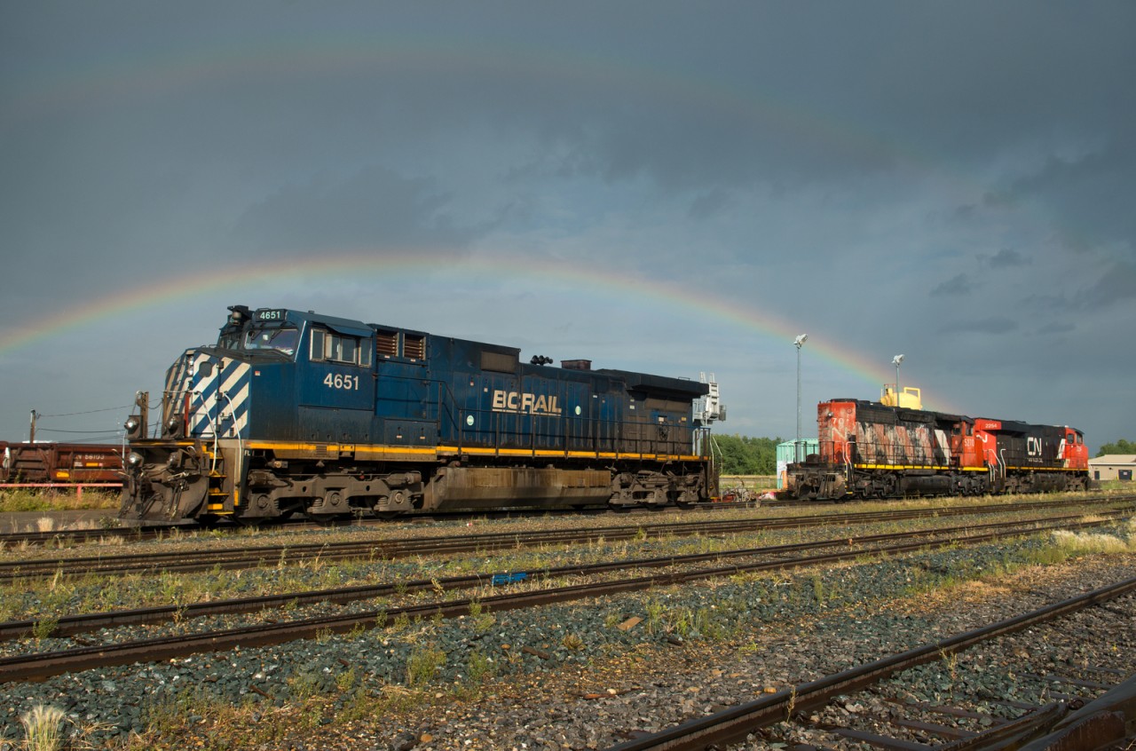 There's no pot of gold to be seen beneath this double rainbow, just a few parked units waiting to go to work.