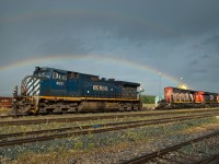 There's no pot of gold to be seen beneath this double rainbow, just a few parked units waiting to go to work. 