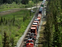 Intermodal train 107 just out of Jasper on the climb to Yellowhead Pass passes the double crossovers at Giekie